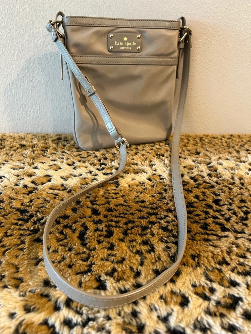 kate spade khaki-green crossbody bag with gold plaque